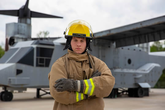 U.S. Marine Corps Lance Cpl. Gabriel R. Gilbert, an expeditionary firefighting and rescue specialist, Headquarters and Headquarters Squadron, Marine Corps Air Station (MCAS) New River, poses for a photo on MCAS New River in Jacksonville, North Carolina (Photo By: Lance Cpl. Rose Spencer)